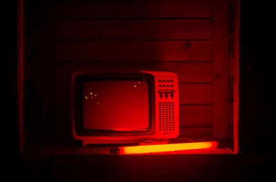 Close-up of illuminated telephone booth