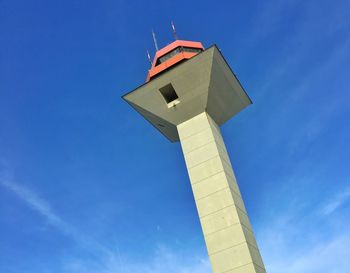 Low angle view of tower against blue sky