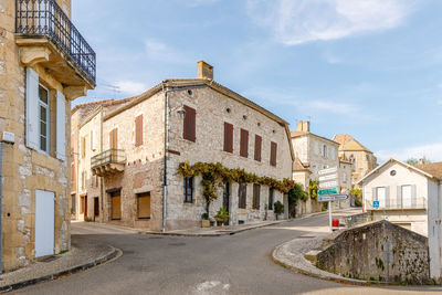 Buildings in city against sky