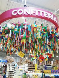 Low angle view of various lanterns hanging in store