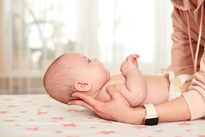 Midsection of doctor examining pregnant woman