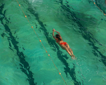 High angle view of man swimming in sea