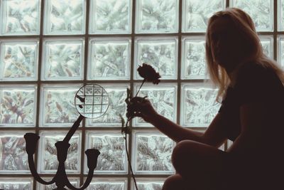 Close-up of woman sitting on bench