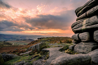 Scenic view of rock formation against sky during sunset