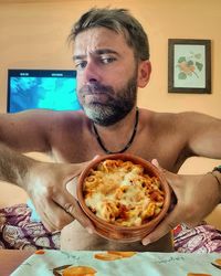 Portrait of a man sitting at table