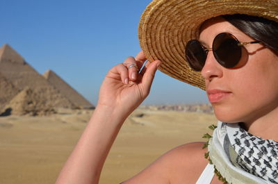 Close-up of young woman wearing sunglasses