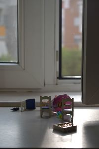 Close-up of open door on table at home