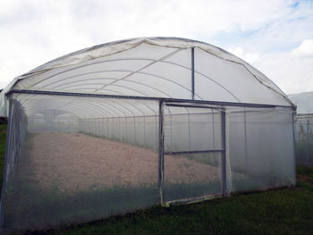 Built structure on field against sky