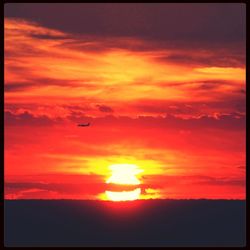 Scenic view of dramatic sky at sunset