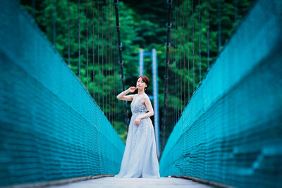 Woman standing by the wall