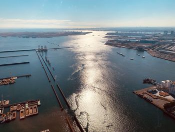 High angle view of harbor by sea against sky