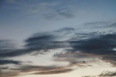 Low angle view of cloudy sky during sunset