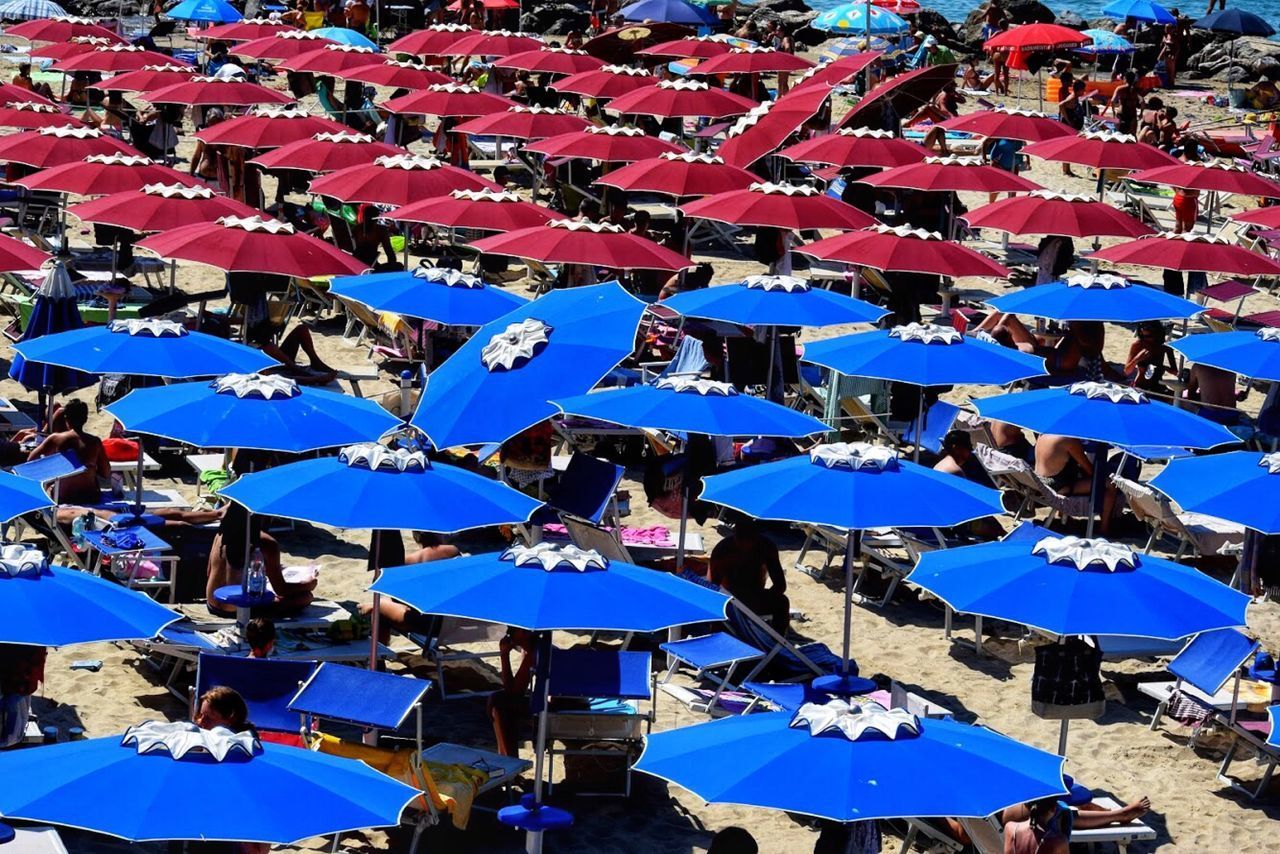 HIGH ANGLE VIEW OF PEOPLE WITH UMBRELLA