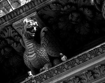 Low angle view of statue on roof