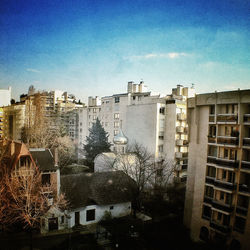 Low angle view of buildings against blue sky