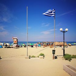 Scenic view of beach against blue sky