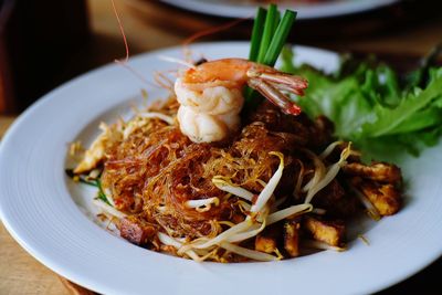 Close-up of noodles served in plate on table