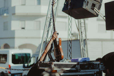 Close-up of man holding guitar