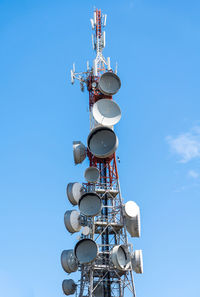 Broadcast and telecomunication antenna on blue sky
