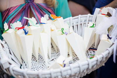 Midsection of woman with paper decorations