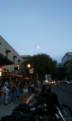 People on city street at night