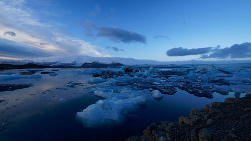 Scenic view of sea against sky during winter