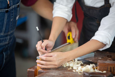 Midsection of man preparing food