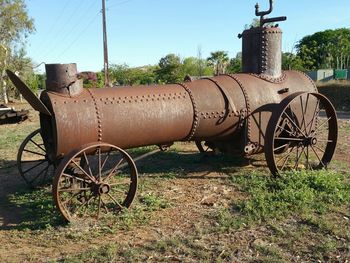 Old rusty bicycle on field