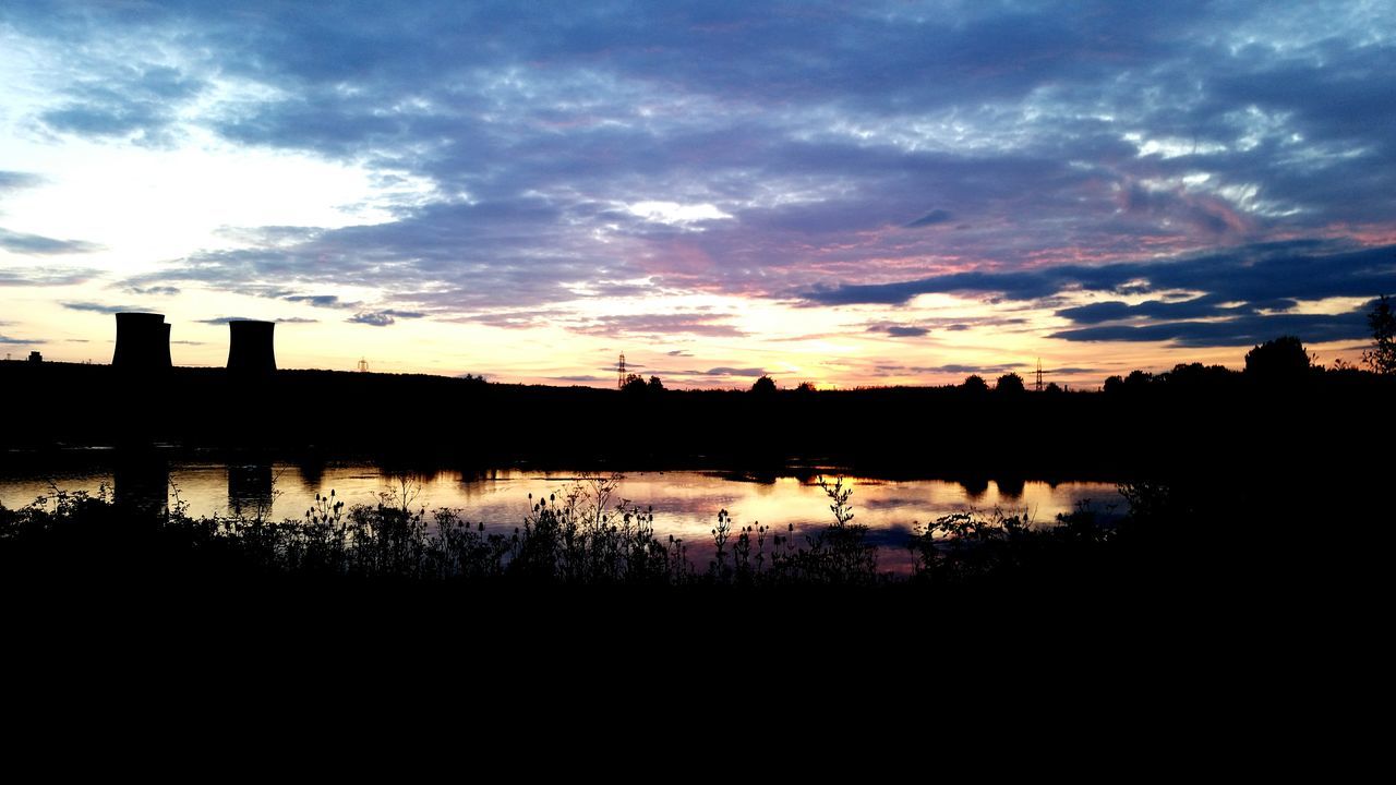 sunset, silhouette, sky, water, cloud - sky, lake, reflection, scenics, tranquil scene, beauty in nature, tranquility, cloud, river, nature, cloudy, idyllic, dramatic sky, built structure, building exterior, dusk