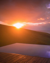 Scenic view of landscape against sky during sunset