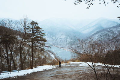 Scenic view of snow covered mountains against sky