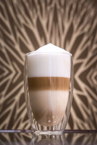 Close-up of coffee cup on table