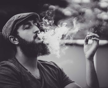 Young man smoking cigarette