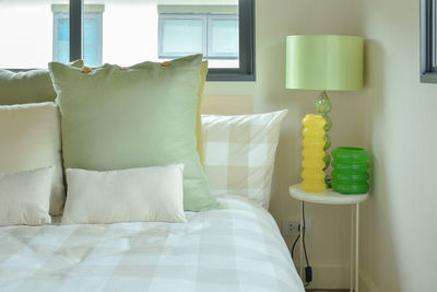 Cushions and pillows on bed