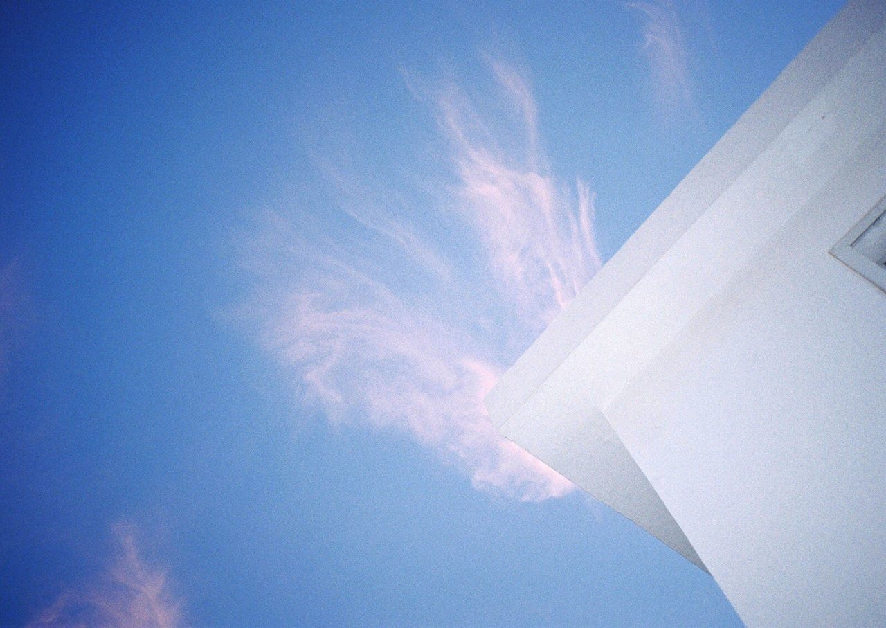 low angle view, blue, vapor trail, sky, cloud, day, cloud - sky, tranquility, beauty in nature, no people, scenics