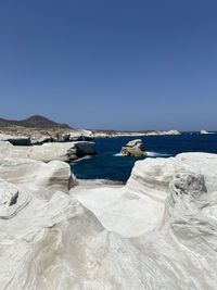 Scenic view of sea against clear blue sky