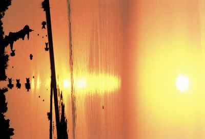 Scenic view of calm sea at sunset