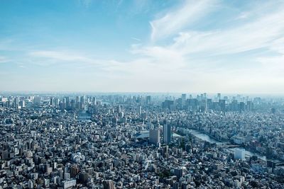 Aerial view of city against sky