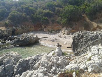 High angle view of sea on rock formation at beach