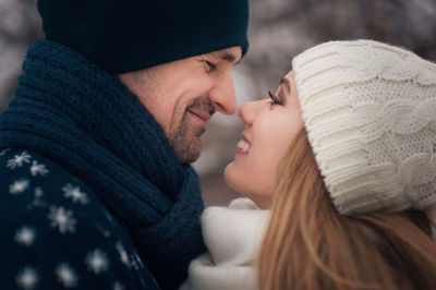 Close-up of romantic smiling couple looking at each other
