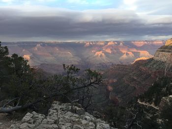 Scenic view of mountains against sky at sunset