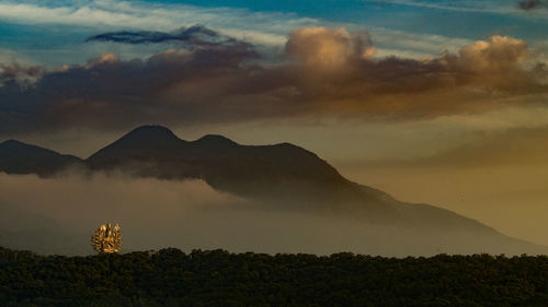 Scenic view of silhouette mountains against sky during sunset