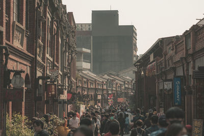 People walking on street in city