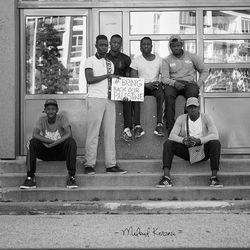 Group of people sitting outdoors