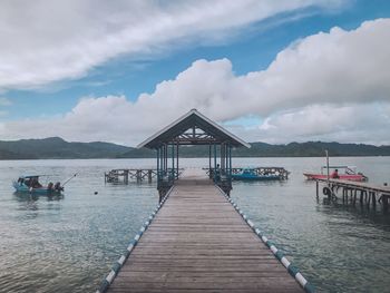 Pier over sea against sky