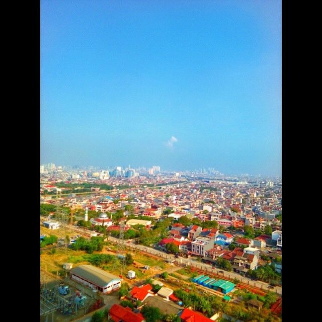 cityscape, building exterior, architecture, built structure, city, crowded, high angle view, residential district, residential structure, residential building, aerial view, copy space, clear sky, house, town, blue, community, sky, townscape, city life