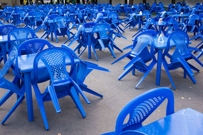 High angle view of empty chairs and table in cafe
