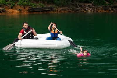 People on boat in lake