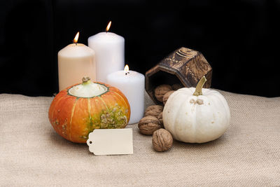 Close-up of pumpkin on table against black background