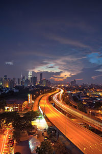 High angle view of illuminated cityscape at dusk